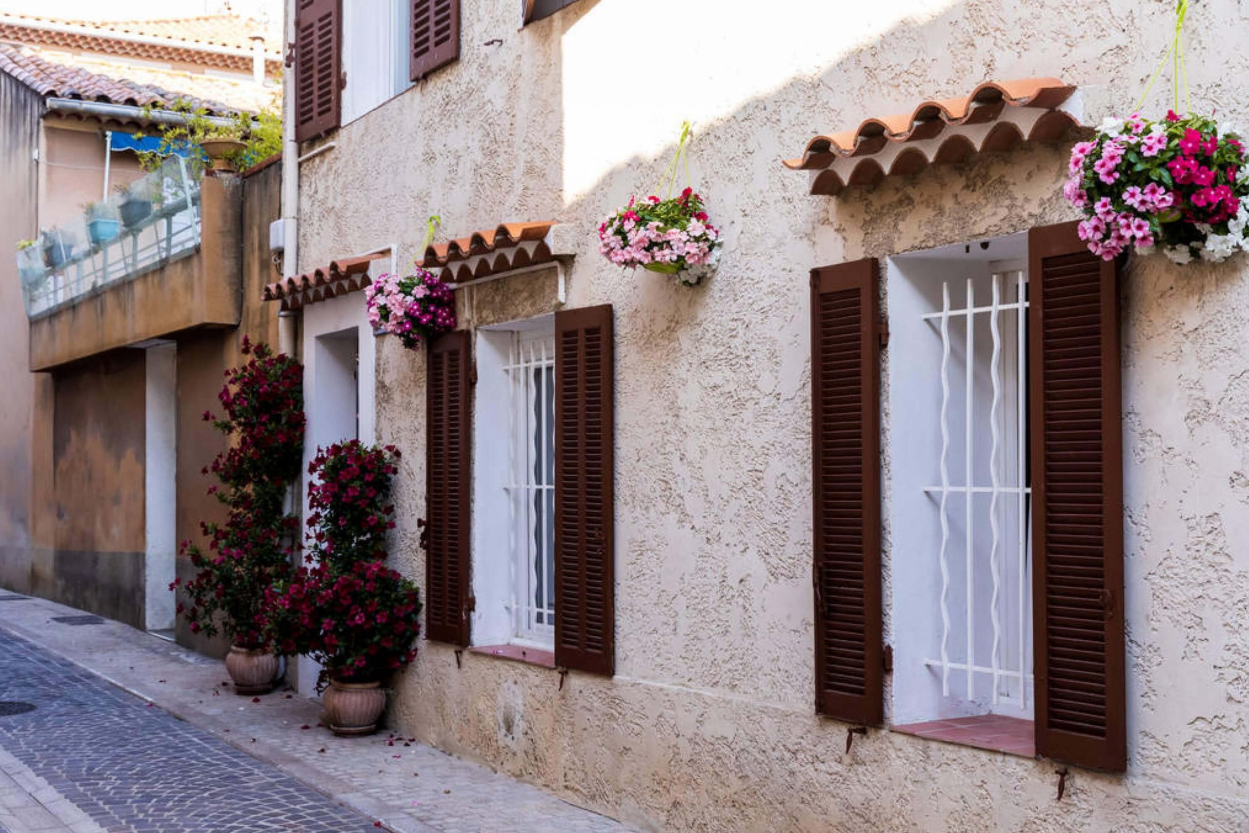 Tan House With Brown Shutters