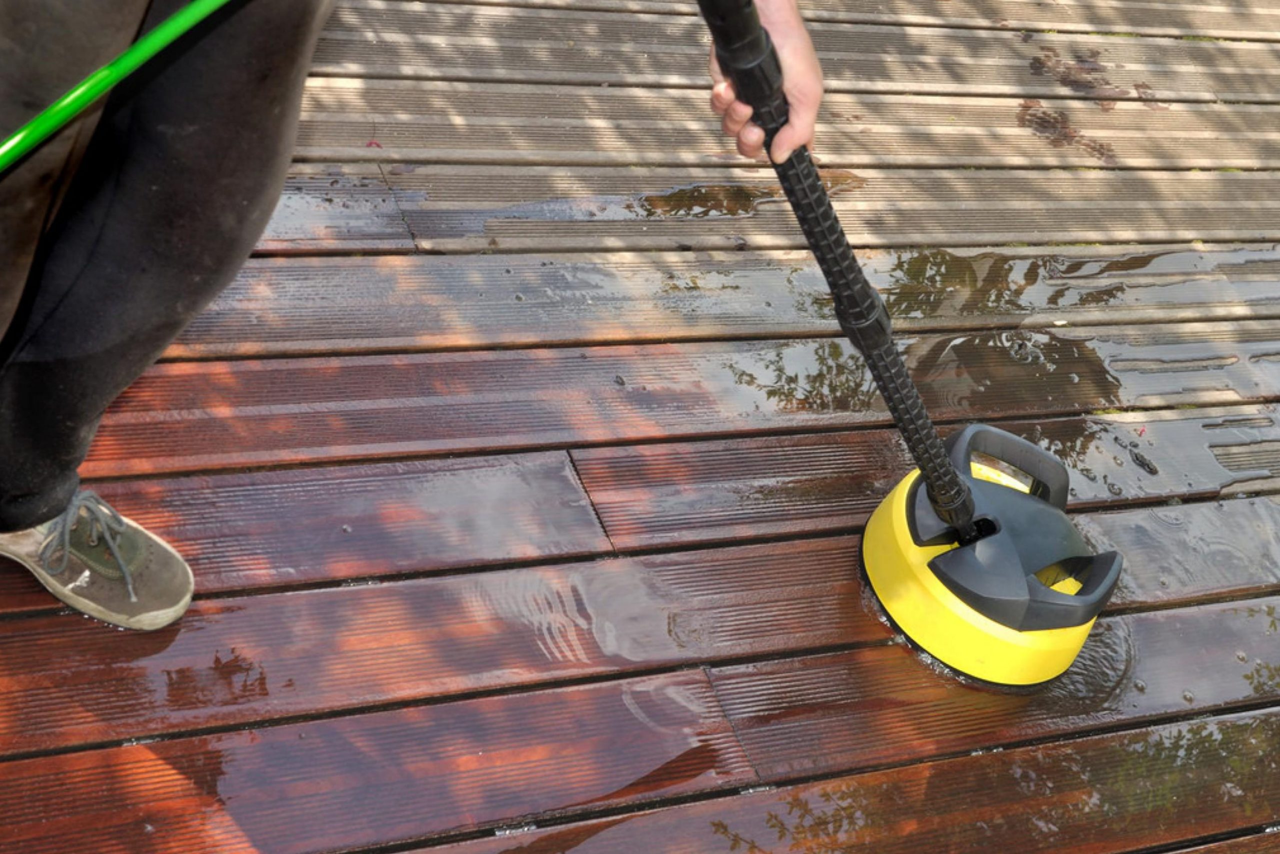 Using A Pump Sprayer to Paint Cracks Between Deck Boards